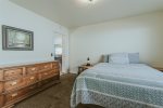 Large dresser and spacious bedroom